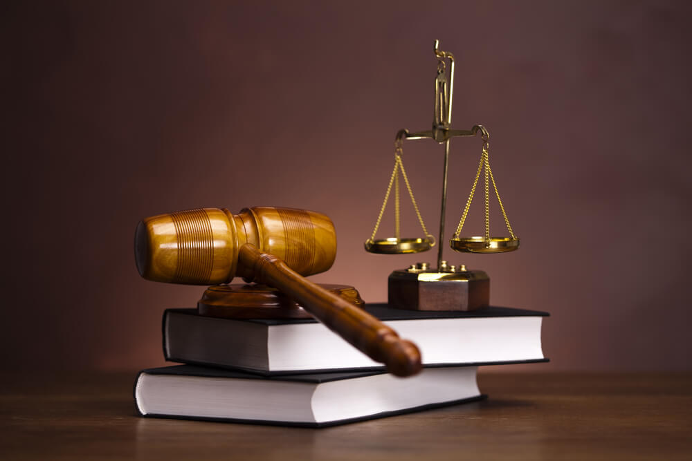 Legal advisory, gavel and law book